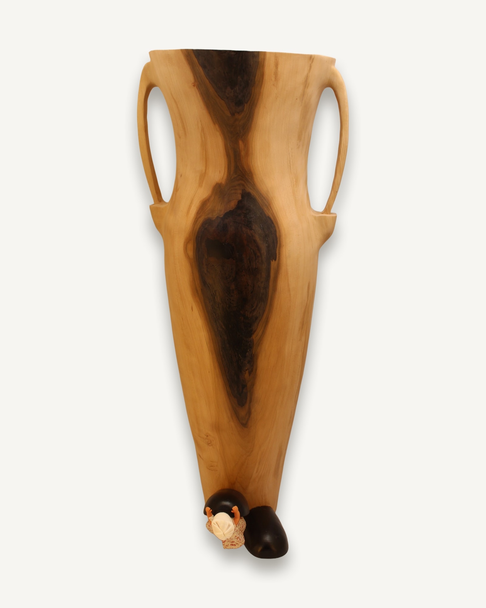 Tall turned beechwood vase with two handles and dark rot markings down its body